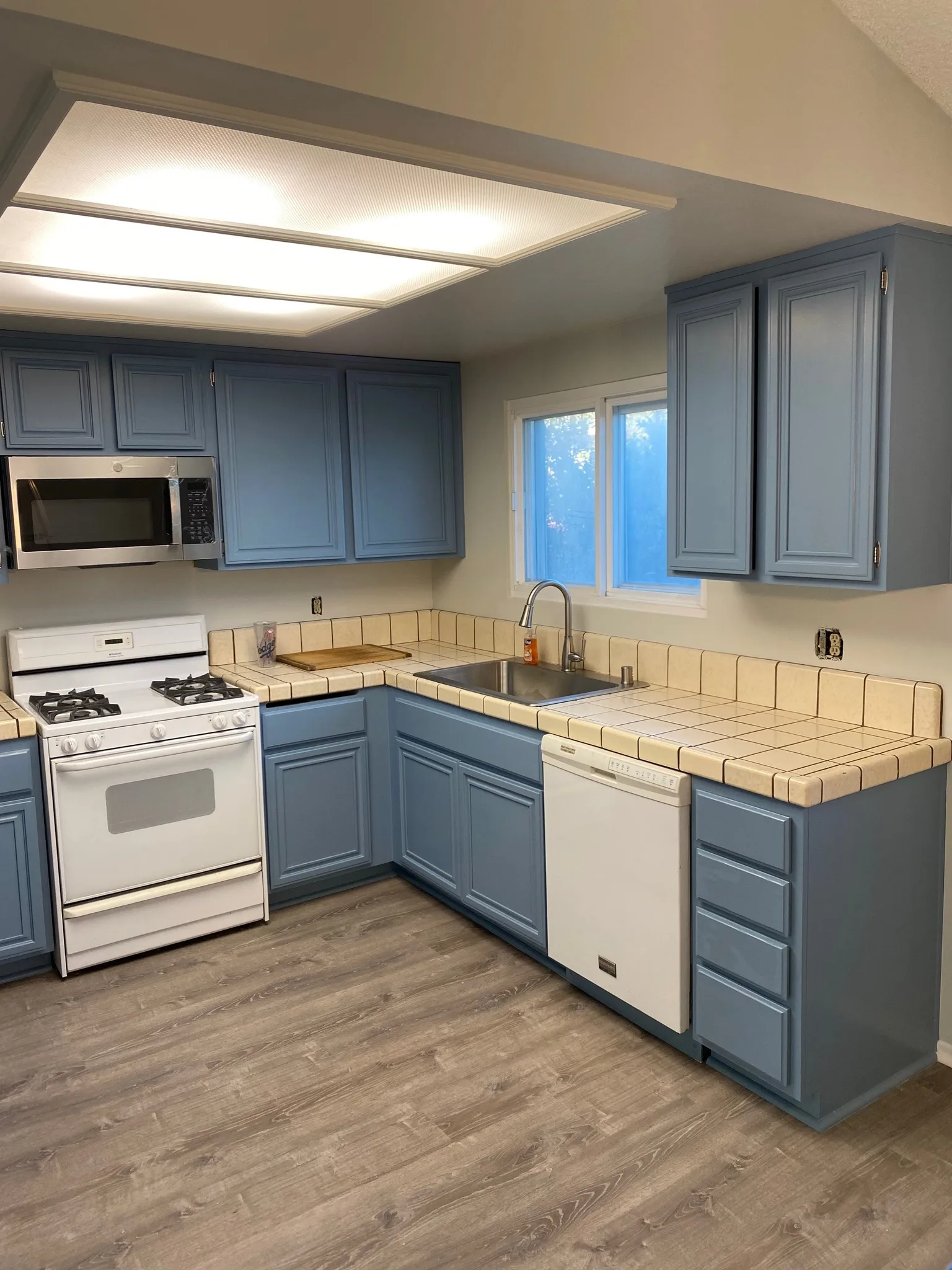 Kitchen cabinets refinished in slate blue