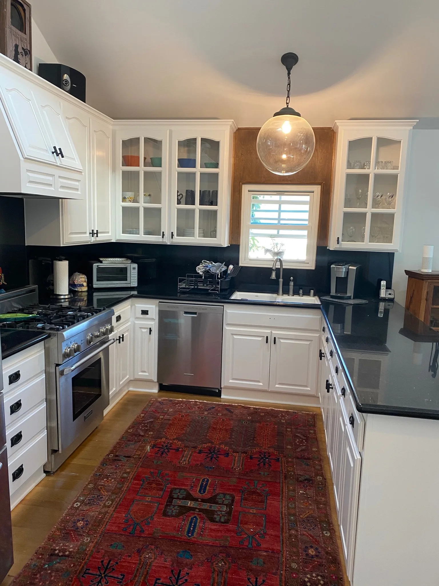 Wall of white cabinetry with built-in desk nook