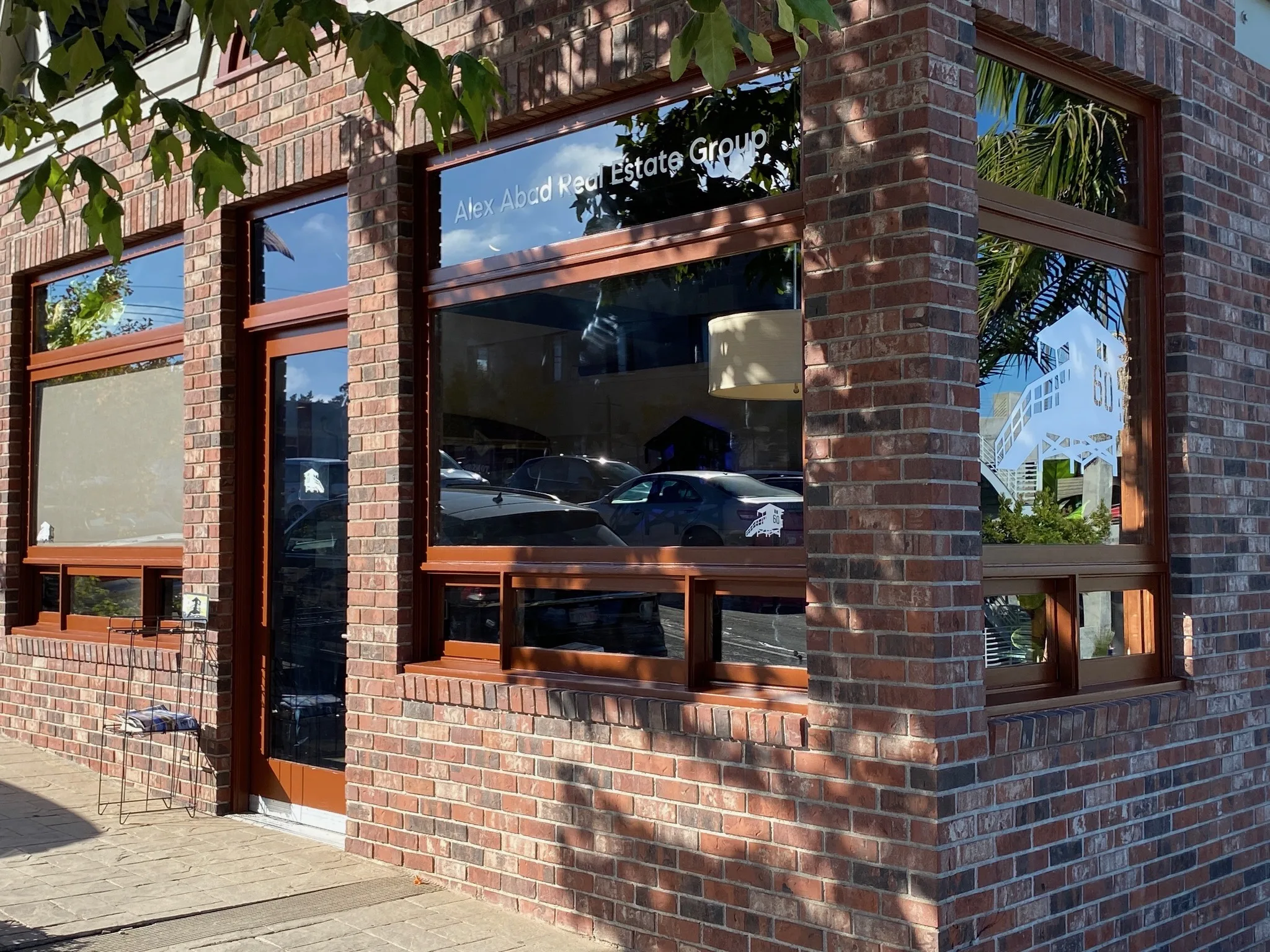 Brick storefront with refinished wood window trim