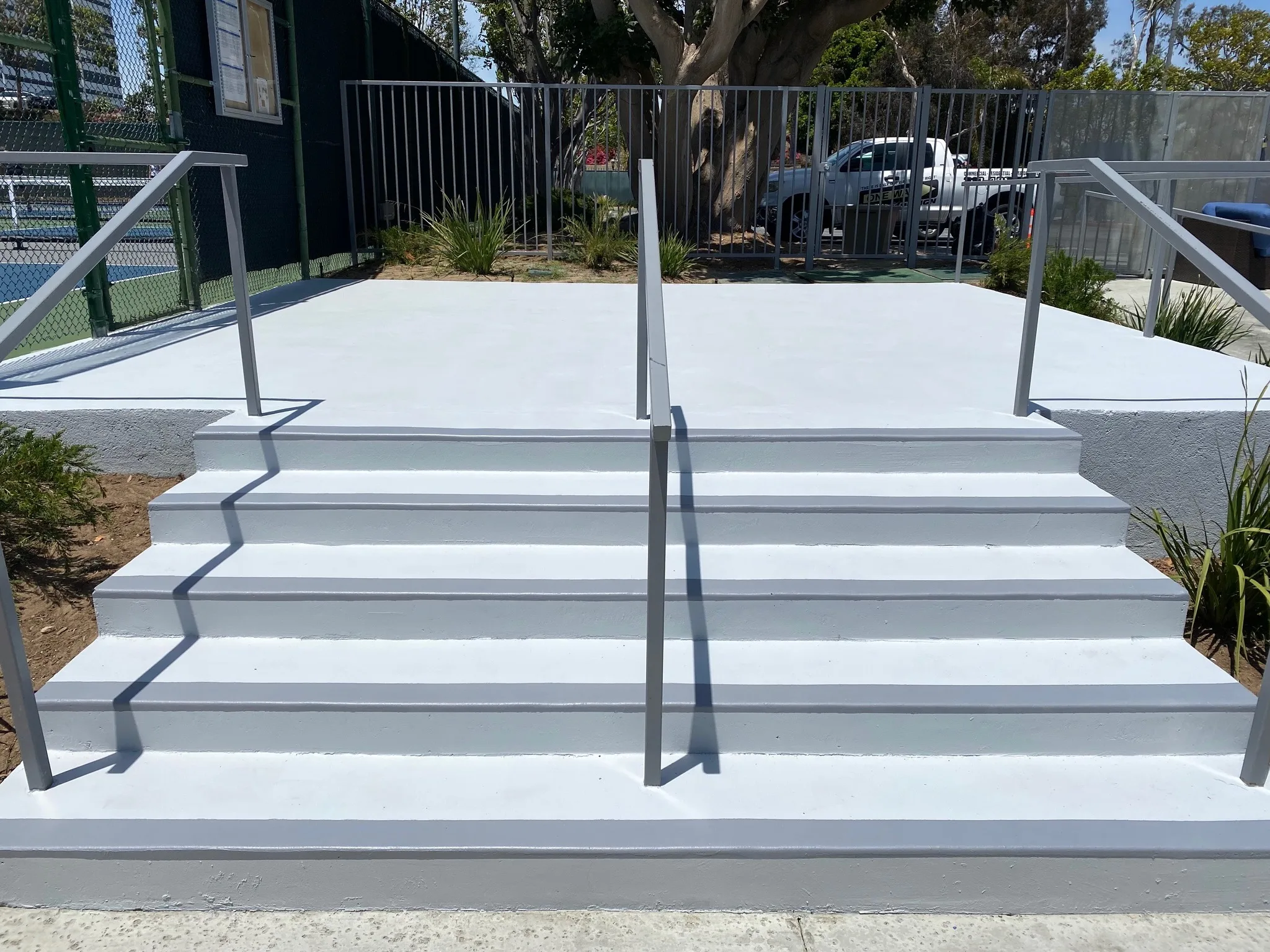 Concrete patio and steps refinished in gray