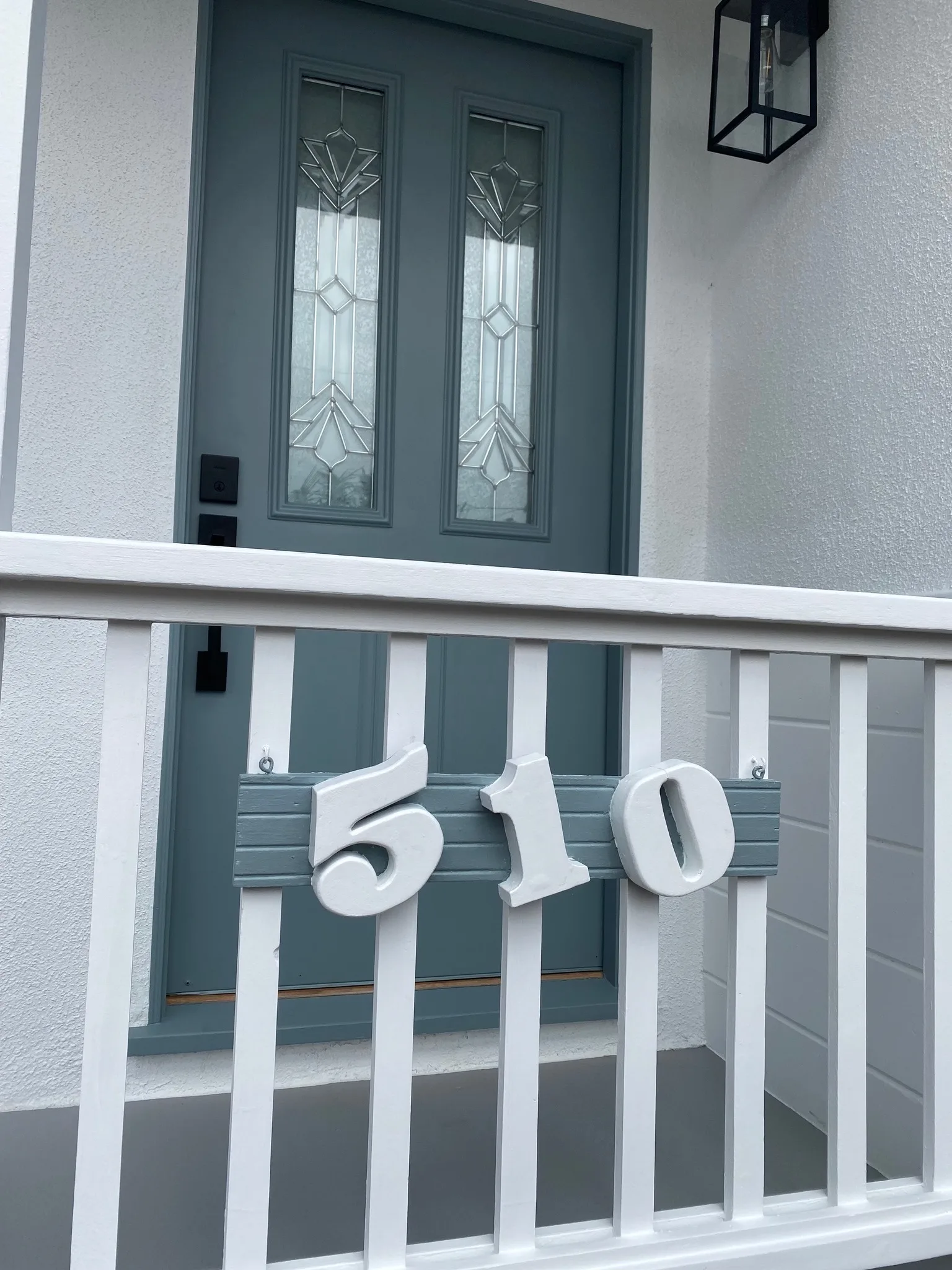 Front porch with refinished floor and repainted door