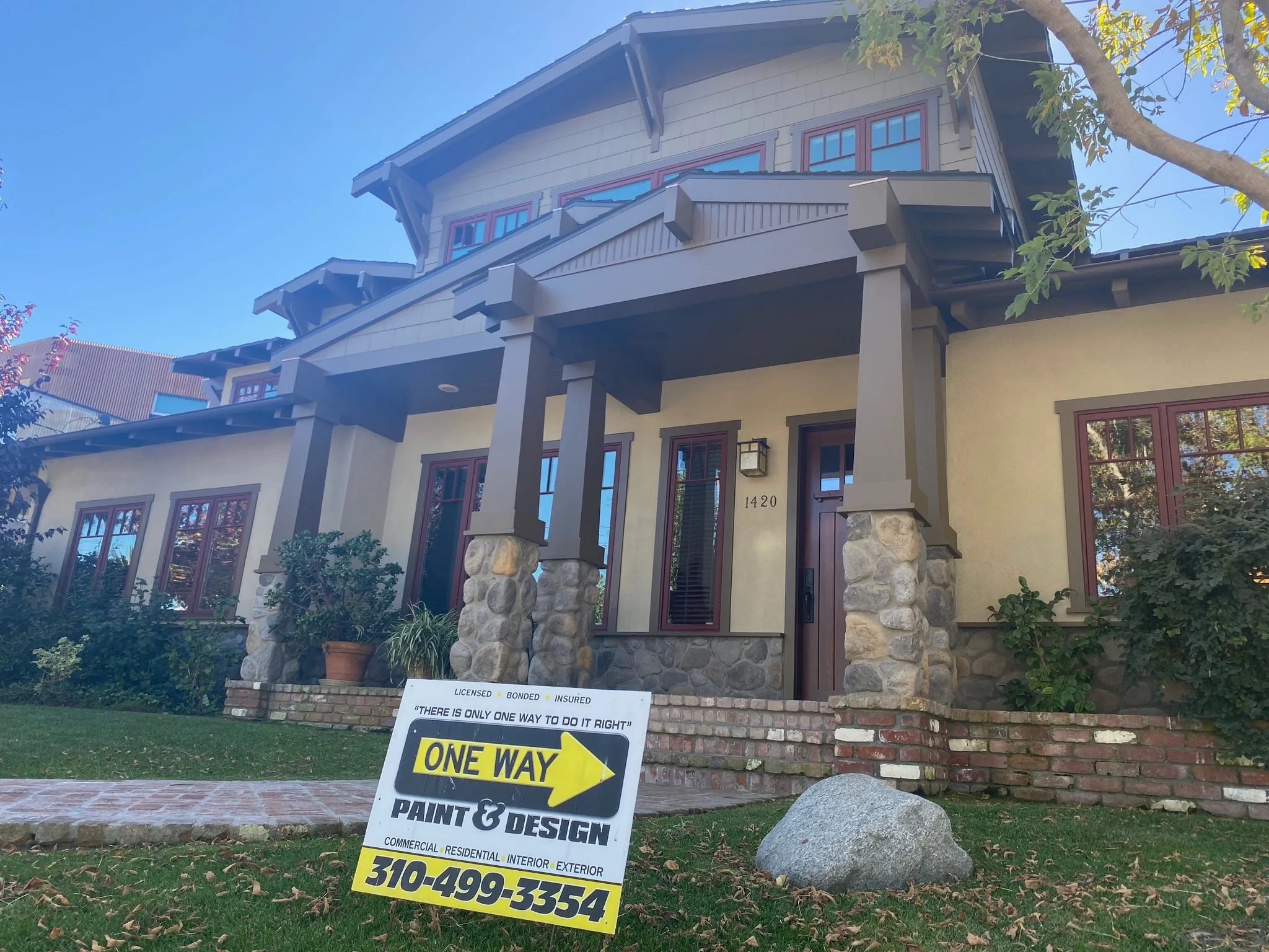 Freshly painted craftsman porch in El Segundo with a One Way Paint & Design yard sign