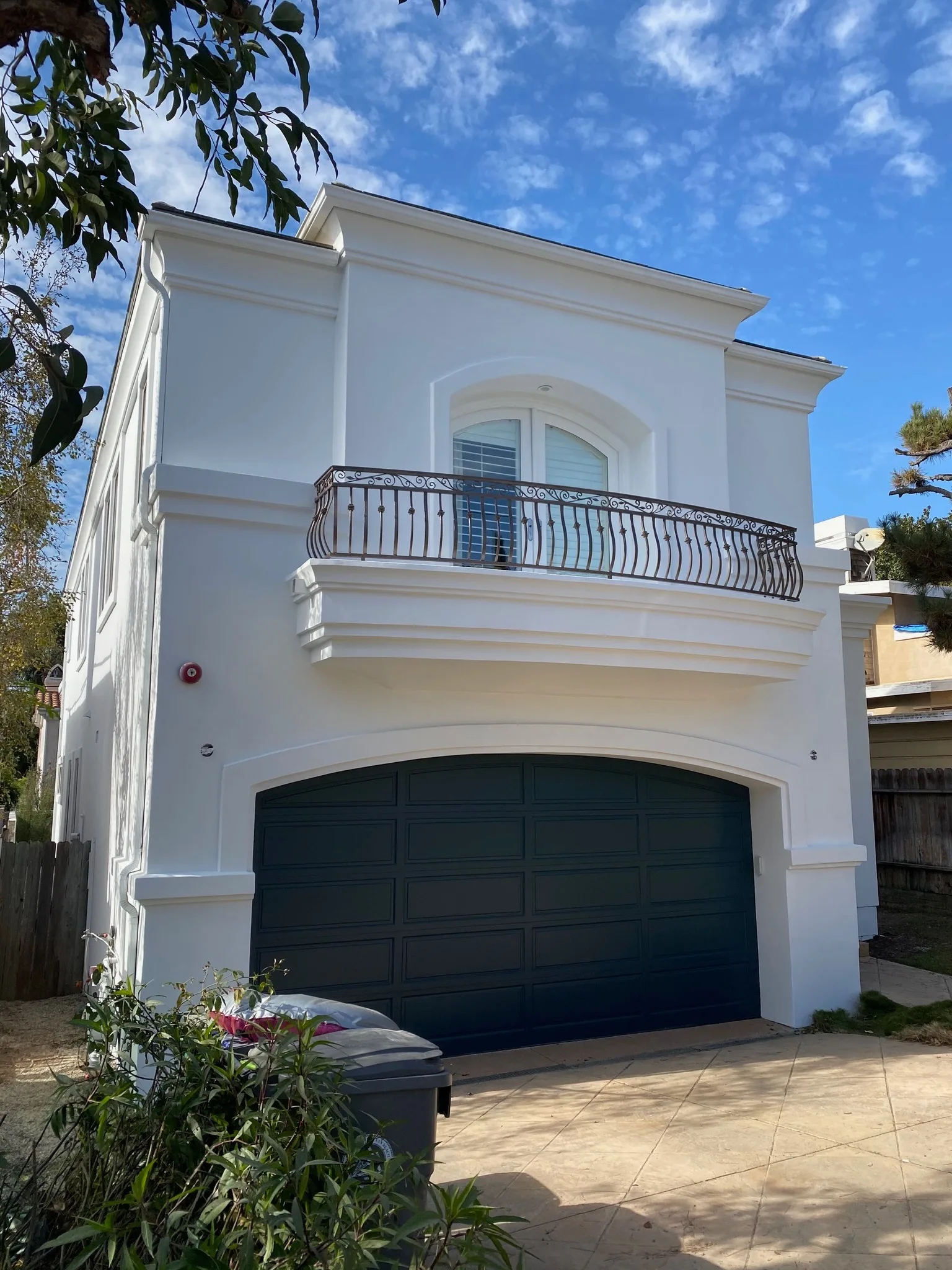 Two-story white home exterior with fresh paint in the South Bay